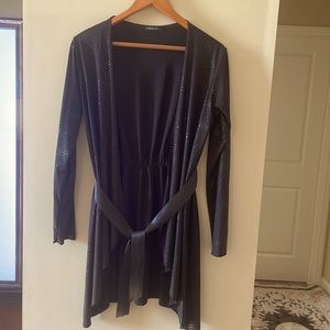 Black jacket size L with a satin belt.